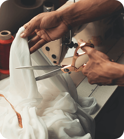 Hands cutting fabric