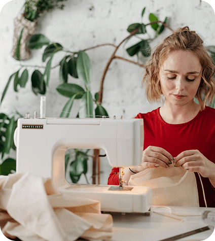 Woman using sewing machine
