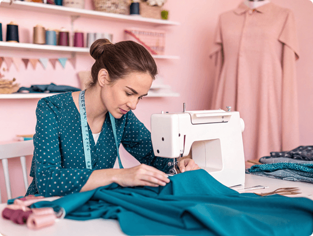 Tailor working with sewing machine